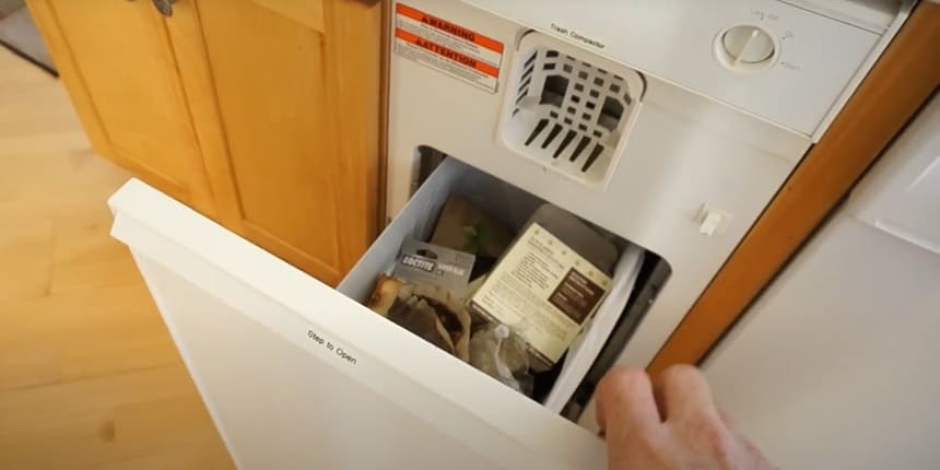 how do trash compactors work